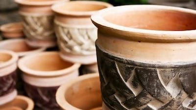 Pots made from porous materials such as terracotta allow water to evaporate, which can cool plant's roots in summer. iStockphoto.com