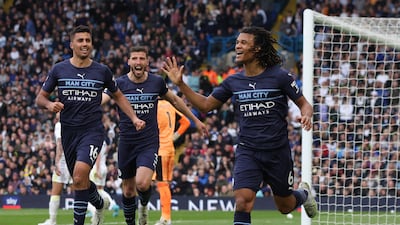 Nathan Ake celebrates scoring the second goal with Rodri and Ruben Dias. Reuters