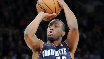 Kemba Walker had 25 points for Charlotte in New York on Tuesday night. Bill Kostroun / AP