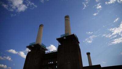 A rig surrounds the top of one of the chimneys of Battersea Power Station. Developers have demolished the art deco landmark's corroded chimney's and will replace them with replicas, as part of the re-development of the area. Andrew Winning / Reuters