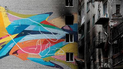 A mural on the wall of an apartment building damaged during the Ukraine-Russia conflict in Popasna, Luhansk region. Reuters