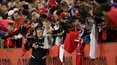 Manchester United Manager Ole Gunnar Solskjaer takes a selfie with fans after a training session at the WACA in Perth, Australia. EPA