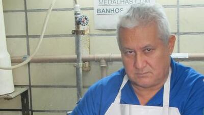 Idelberto Marinho do Rosario removes two gold medals from the electroplating tank. When they entered the solution, they were silver in colour. Gary Meenaghan for The National