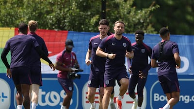 England's Declan Rice and Luke Shaw training with teammates on the eve of their Euro 2024 Group C match against Slovenia. AFP