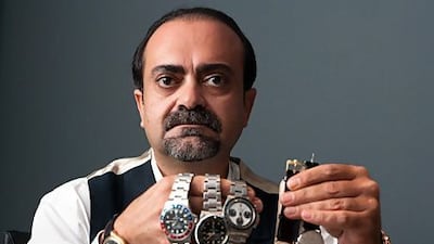 Joe Haj Ali displays some examples from his vintage watch collection. Duncan Chard for The National