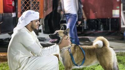 A pet owner with his dog.