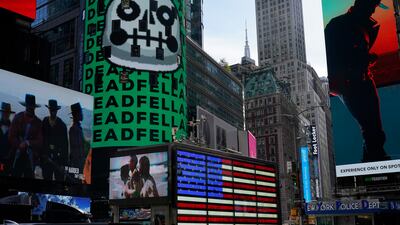 An NFT, or non-fungible token, is displayed on a billboard in Times Square, New York. SoftBank's internet arm Z Holdings will be among the early adopters of NFT trading in Japan. AP
