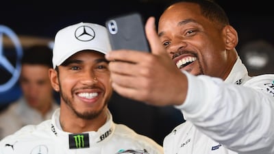 Lewis Hamilton and Will Smith take a selfie in the Mercedes garage before the Abu Dhabi Formula One Grand Prix at Yas Marina Circuit. Getty