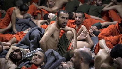 Alleged affiliates of ISIS in a prison in the north-eastern Syrian city of Hasakeh. Kurdish sources say around 12,000 of them are being held in Kurdish-run prisons AFP