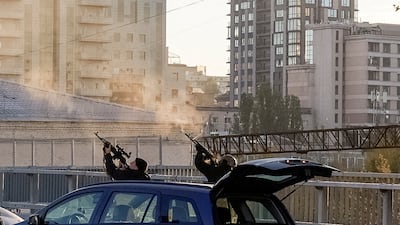Police officers shoot at a drone during a Russian drone strike, which local authorities consider to be Iranian-made Shahed-136 unmanned aerial vehicles (UAVs), amid Russia's attack on Ukraine, in Kyiv, Ukraine October 17, 2022. REUTERS / Vadim Sarakhan
