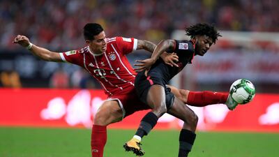 Bayern Munich's James Rodriguez in action with Arsenal's Ainsley Maitland-Niles during their pre-season match at the Bird's Nest stadium in China. Aly Song / Reuters
