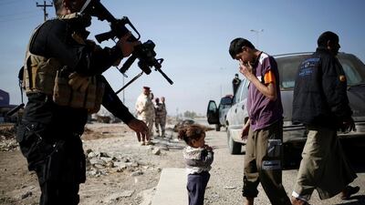 A girl who just fled Samah district of eastern Mosul stands with a relative as she arrives at Iraqi Special Forces checkpoint in Kokjali, east of Mosul, Iraq November 5, 2016. REUTERS/Zohra Bensemra