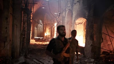 One of Aleppo's historical neighbourhoods burns during an assault by Assad's military in 2012. Courtesy Sipa USA / REX