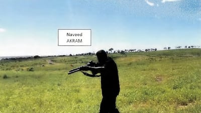 A court exhibit shows a frame grab taken from a video recorded in October of Naveed Akram allegedly firing a shotgun and moving in a tactical manner in a countryside location, suspected to be in New South Wales. AFP