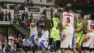 Jarrid Famous of GlobalPort Batang Pier attempts a shot against Rain or Shine Elasto Painters during their PBA game on Thursday in Dubai. Antonie Robertson / The National