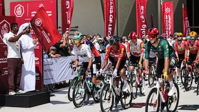 Riders wait at the start line of the final stage of the UAE Tour cycling event at Zayed National Museum. AFP