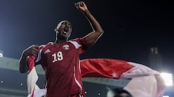 Almoez Ali celebrates after Qatar beat the UAE to qualify for the 2026 World Cup finals. Getty Images
