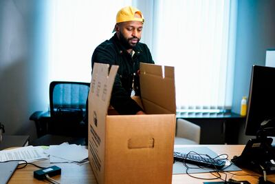 Britain's MEP of the Green party Magid Magid packs his belongings in his office at the European Parliament in Brussels. AFP