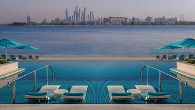 The swimming pool and beach offer views of Dubai's city skyline. Courtesy The Retreat Palm Dubai MGallery by Sofitel 