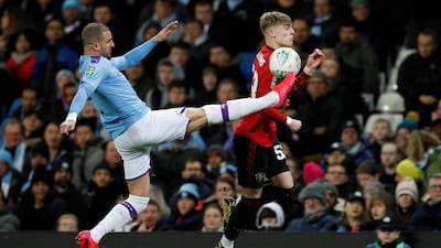 Manchester United's Brandon Williams vies for the ball with Manchester City's Kyle Walker in the League Cup semi-final second leg. Reuters