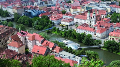 Graz mixes traditional architecture with modern urban traits, including the artificial Mur Island, which floats on the River Mur. Weinhaeupl / Österreich Werbung