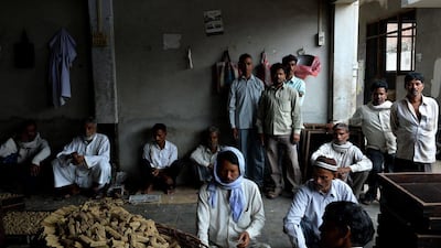 Labourers work at The New Sarkar Bidi Factory in Kannauj.