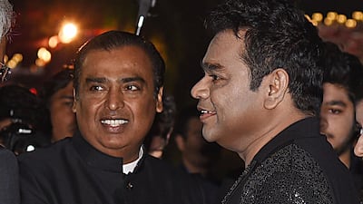 Mukesh Ambani (L) and musician A.R. Rahman (R). Photo: AFP