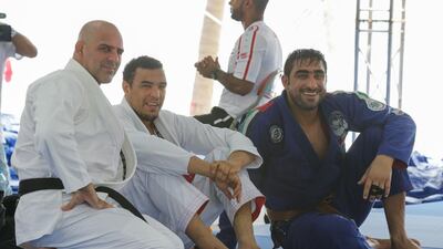 Faisal Al Ketbi, centre, and Yahia Mansour Al Hammadi, right, are in action at the Abu Dhabi Grand Tour Tokoyo this weeekend. Courtesy UAE Jiu-Jitsu Federation