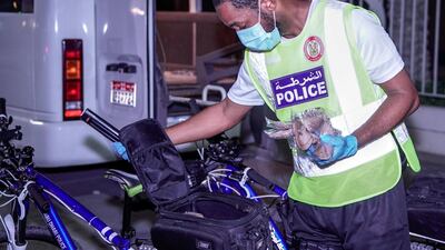 Abu Dhabi Police bicycle patrol on night operations around the Mussaffah area to warn or catch curfew violators in the residential areas. Victor Besa / The National
