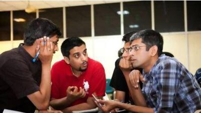 A team ponders a question at a Karnataka Quiz Association meeting this month. Amirtharaj Stephen for The National