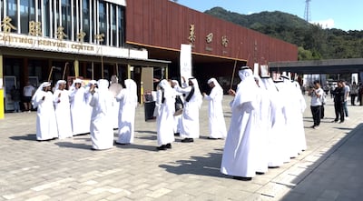 An Emirati group performs the traditional Al Ayyala dance in front of the Great Wall. Evelyn Lau / The National