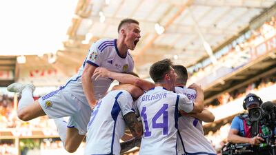 Scotland's players celebrate after Lyndon Dykes scored against Norway in their Euro 2024 qualifying match in Oslo on Saturday, June 17, 2023. AFP