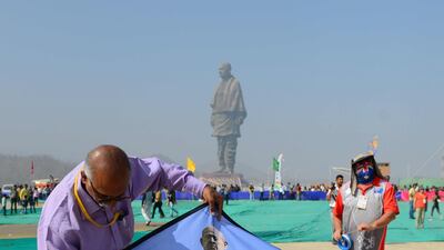 Indian participants prepare to fly a kite decorated with the Statue Of Unity. AFP