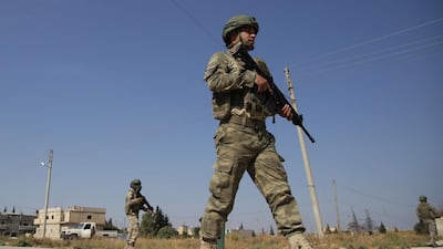 Turkish soldiers patrol the northern Syrian Kurdish town of Tal Abyad, on the border between Syria and Turkey. AFP