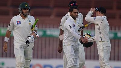 Pakistan batsman Mohammed Hafeez, centre, was unbeaten on 178 after end of Day 1's play in Sharjah. Aamir Qureshi / AFP