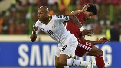 Ghana’s midfielder Andre Ayew (L) runs with the ball during the 2015 African Cup of Nations semi-final football match between Equatorial Guinea and Ghana in Malabo, on February 5, 2015. AFP PHOTO / ISSOUF SANOGO