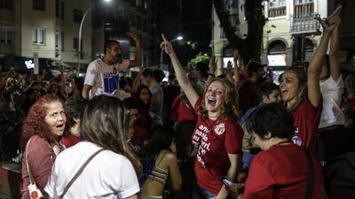 Lula supporters in jubilant mood in Rio de Janeiro. However, the election will go to a run-off as the leftist candidate fell short of 50 per cent of the vote. EPA