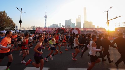 Runners take part in the 2020 Shanghai marathon. AFP