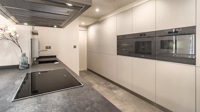 The apartment comes with a very modern kitchen. Courtesy LuxuryProperty.com