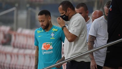 Brazil's Neymar talks to his father Neymar Santos Sr after a training session at the Arena da Amazonia Stadium on October 13, 2021, on the eve of the Qatar 2022 World Cup Qualifier match against Uruguay. AFP