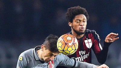 AC Milan’s Luiz Adriano clashes with Alessandria’s Cristian Sosa during their Coppa Italia first-leg semi-final. Alessandro Di Marco / EPA