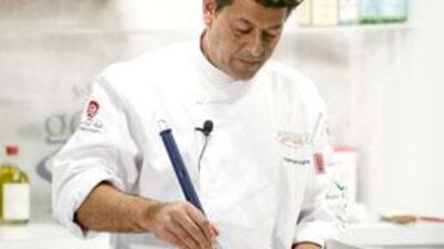 The chef Yves Mattagne stirs liquid nitrogen.