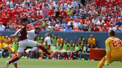 Juan Mata, centre, of Manchester United scores past Alessio Romangnoli, left, and goalkeeper Lukasz Skorupski, right, of AS Roma during their match at the International Champions Cup on Saturday. Justin Edmonds / Getty Images/ AFP
