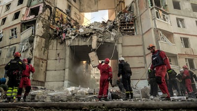 Rescuers work at the site of a Russian strike on a residential building in Kharkiv in 2024. EPA