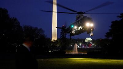 Marine One, carrying US President Donald Trump, first lady Melania Trump, French President Emmanuel Macron and his wife Brigitte Macron, prepares to land on the South Lawn of the White House in Washington, US, on April 23, 2018. Joshua Roberts / Reuters