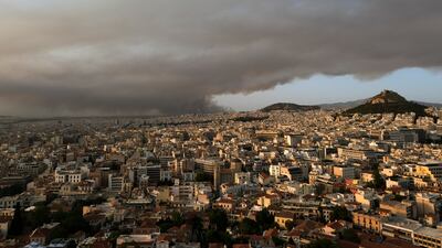 Smoke from a wildfire north of the Greek capital Athens spreads over the city.