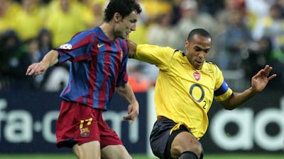 Arsenal striker Thierry Henry challenges Barcelona midfielder Mark Van Bommel. Getty
