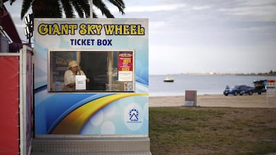 A worker at a beach-front attraction in Geelong. The Australian city of 180,000 people is struggling with the flight of thousands of manufacturing jobs. Jason Reed / Reuters