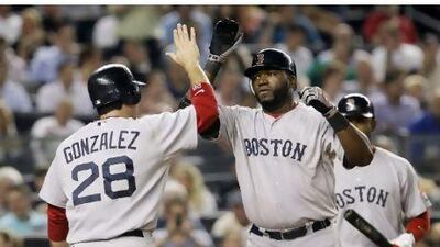 Boston Red Sox's David Ortiz, right, celebrates his two-run home run with Adrian Gonzalez.