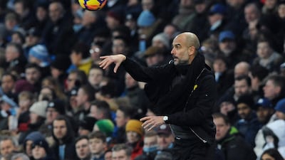 Manchester City manager Pep Guardiola throws the ball back into play during the English Premier League match against Newcastle United at the Etihad Stadium. Rui Vieira / AP Photo